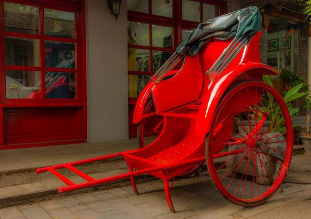 istock A bright red rickshaw in a back alley in a Beijing hutong - 1 1057108424
