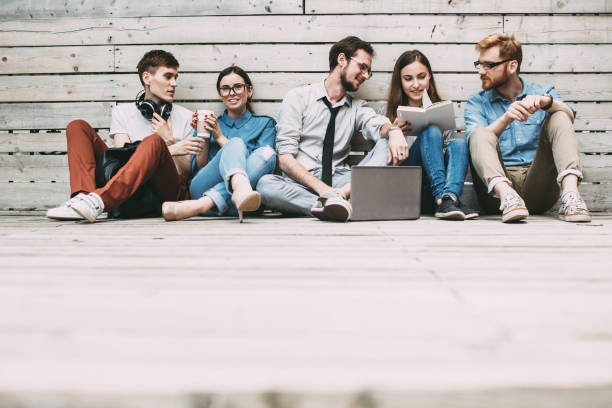 istock Group of confident people sitting and discuss. 1057108566