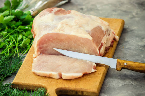 istock piece of pig meat on the Board. Cooking. Selective focus. 1057108802