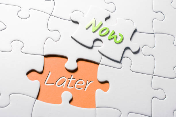 istock The Words Now And Later In Missing Piece Jigsaw Puzzle 1057110462