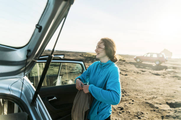 Woman standing near the car