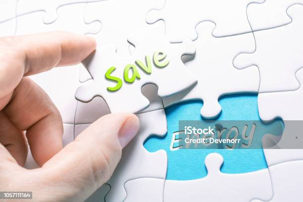 The Words Save And Energy In Missing Piece Jigsaw Puzzle Stock Photo - Download Image Now