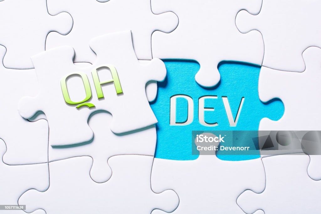 The Words QA And Dev In Missing Piece Jigsaw Puzzle The Words QA And Dev In A Missing Piece Jigsaw Puzzle Computer Software Stock Photo