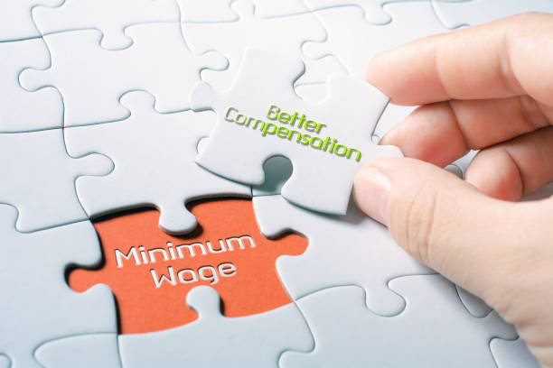 istock The Words Minimum Wage And Better Compensation In Missing Piece Jigsaw Puzzle 1057113060
