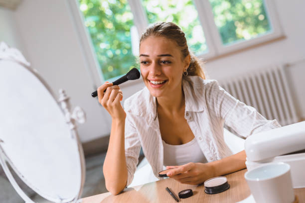 istock woman makeup at home 1057113088