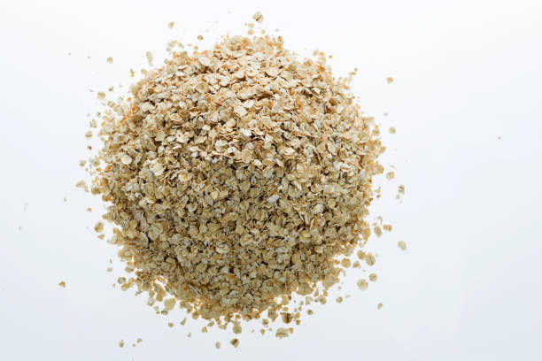 istock A heap of oat flakes on white background 1057113136