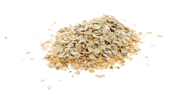 istock A heap of oat flakes on white background 1057113140