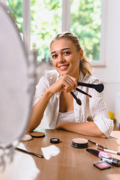 istock woman makeup at home 1057113274