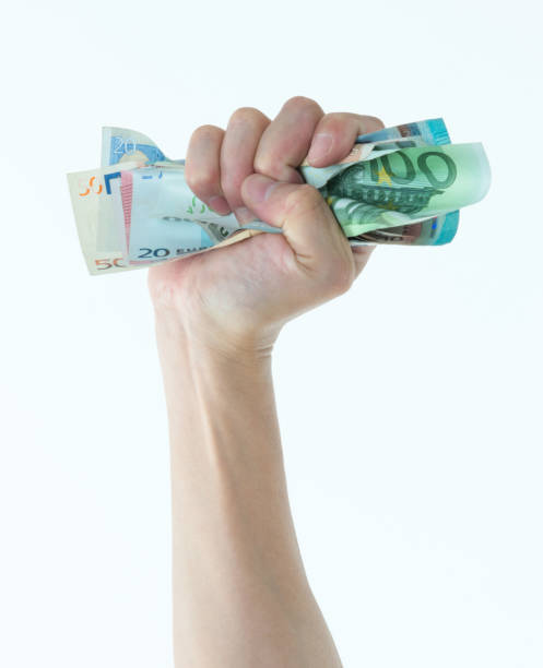 Man hand holding European union currency Man hand holding European union currency. european union euro note stock pictures, royalty-free photos & images