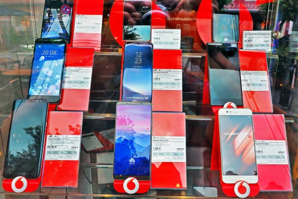 many Smartphone device prices at Vodafone shop displaying on the glass wall  in Munich City Germany Munich Germany - 14 JUNE 2018: many Smartphone device prices at Vodafone shop displaying on the glass wall  in Munich City Germany phone nokia stock pictures, royalty-free photos & images