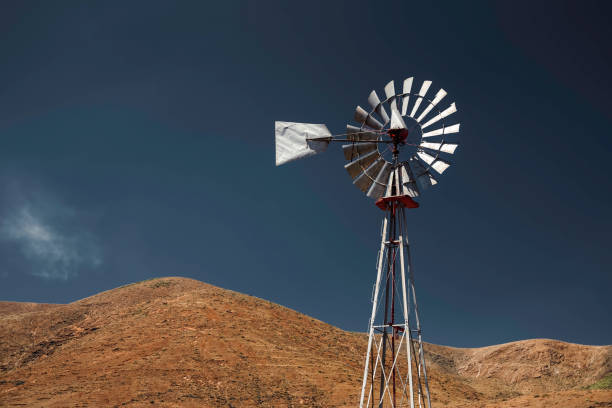 istock wind turbine, volcanic landscape, clear sky 1057120966