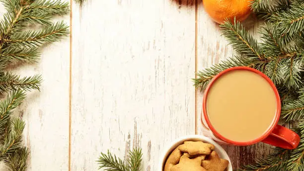 NewYear. Cup of coffee. Delicious tangerines. Spruce branch. Gingerbread Cookie.