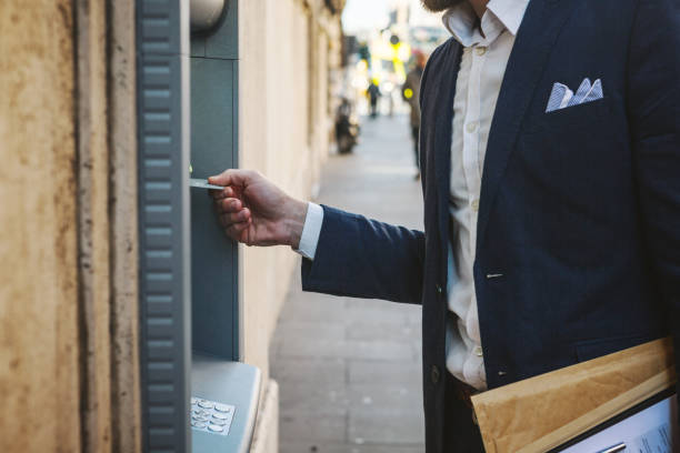 istock Business man withdrawal at atm 1057128730