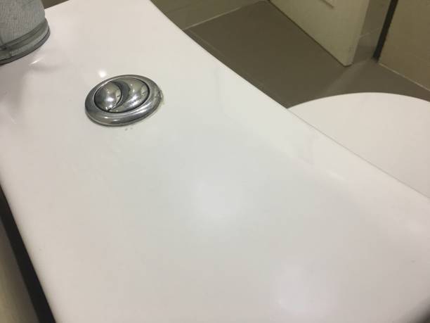 Flush button in toilet close. stock photo