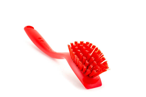 istock red placstic brush isolated on white background 1057136256