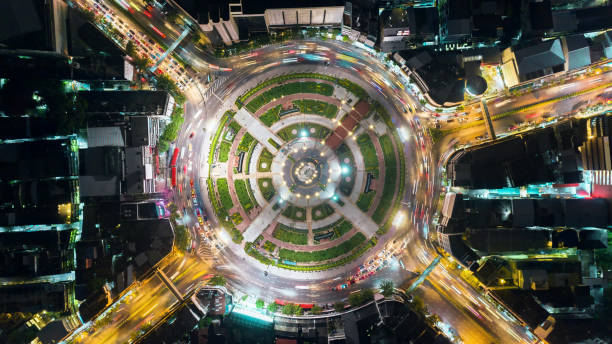 istock Aerial view beautiful pattern highway road intersection at night  for transportation, distribution or traffic background. 1057138590