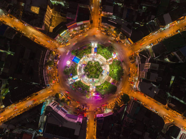 istock Aerial view highway road 6 way circle intersection at night for transportation, distribution or traffic background. 1057138800