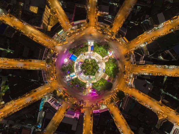 istock Aerial view highway road 12 way circle intersection at night for transportation, distribution or traffic background. 1057138818