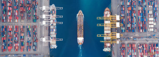 aerial view panoramic oil tanker moving pass sea port warehouse and container ship or crane ship working for delivery containers shipment. suitable use for energy power or transport or import export to global logistics concept. - moored boats imagens e fotografias de stock