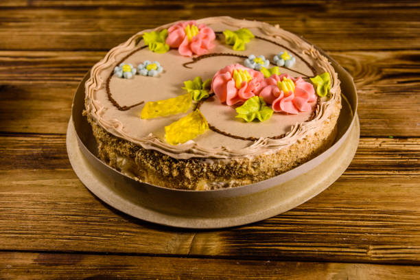 istock Kiev cake with cream on wooden table 1057141056