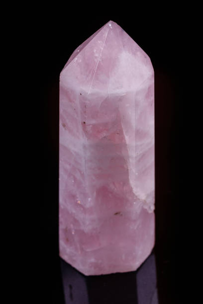istock Macro mineral pink quartz crystal on a black background 1057144018