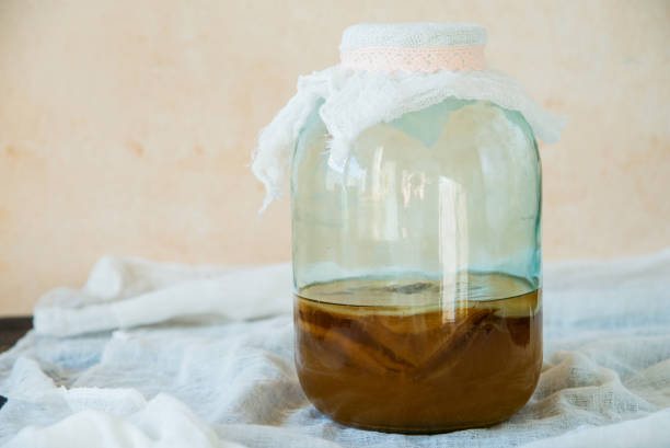 istock Tea mushroom, Kombucha in a glass jar. 1057146848