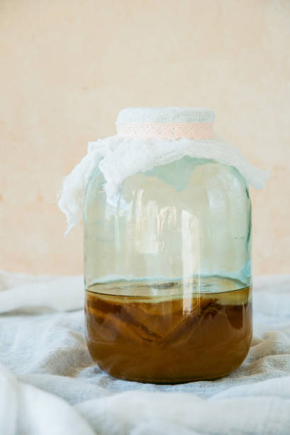 istock Tea mushroom, Kombucha in a glass jar. 1057146878
