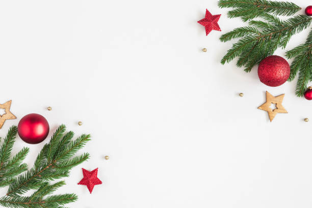 istock Christmas composition. Fir tree branches, red and golden decorations on pastel gray background. Christmas, winter, new year concept. Flat lay, top view, copy space 1057149794