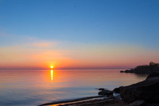 istock landscape - sunset on the coast, waves, horizon. top view. 1057151136