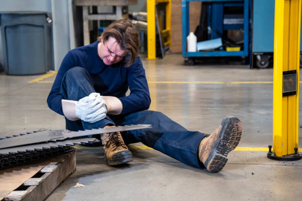 istock An industrial safety topic.  A worker tripping over a poorly placed piece scrap metal in a factory. 1057151164