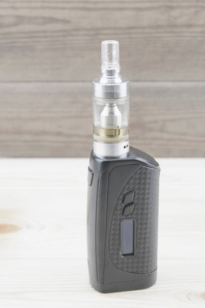 istock E - cigarette for vaping , technical devices.The liquid in the bottle 1057154536