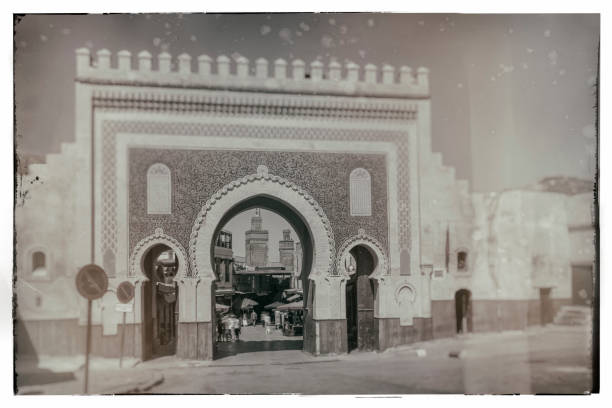 Old nostalgic photo of  Bab Boujeloud door - Morocco This photograph is worn out with digital technology effects. bab boujeloud stock pictures, royalty-free photos & images
