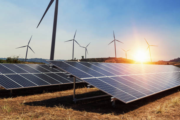 istock solar panel with wind turbine and sunlight. clean power energy concept 1057161216