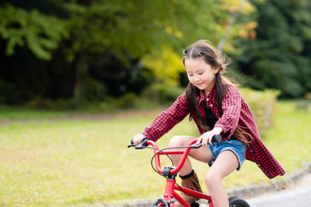 istock Girl rides a bicycle 1057161344