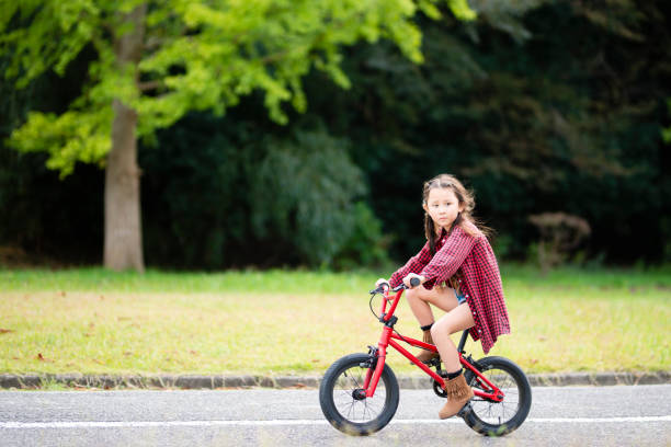 istock Girl rides a bicycle 1057161350