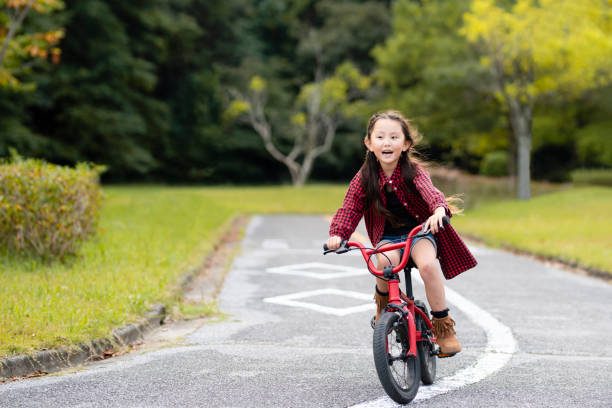 istock Girl rides a bicycle 1057161352