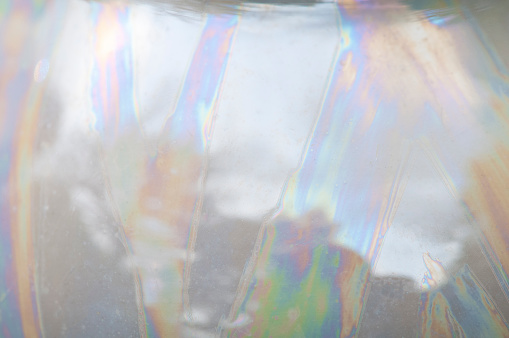Close-up image of mother of pearl patterns on an old English tea pot.
