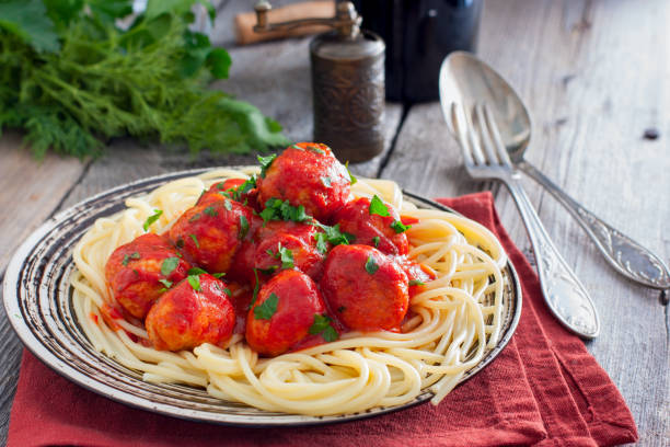 istock Pasta and meatballs with tomato sauce, selective focus 1057168396