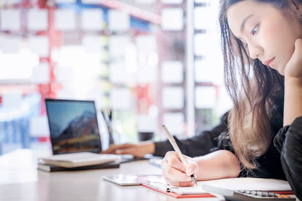 istock Bored businesswoman working at office desk. 1057174008