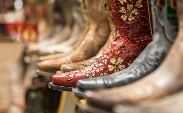 istock Close-up of new cowboy boots on shelf 1057179934