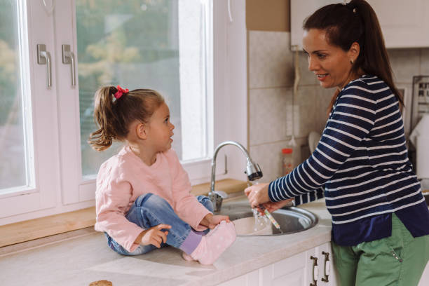 istock mother and daughter spending great time cooking in kitchen 1057180108
