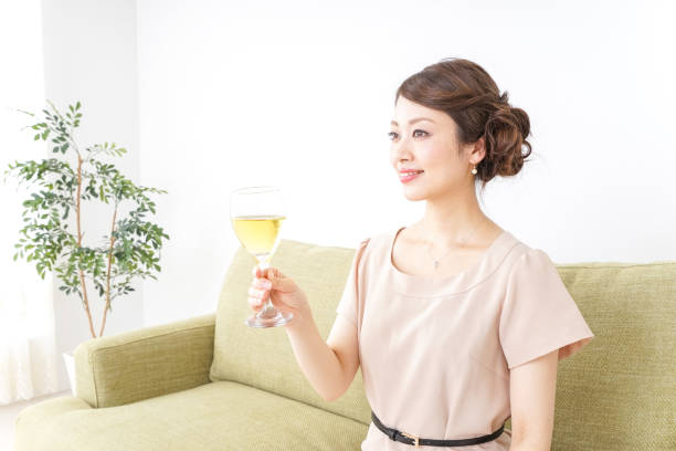 istock woman drinking wine 1057180240