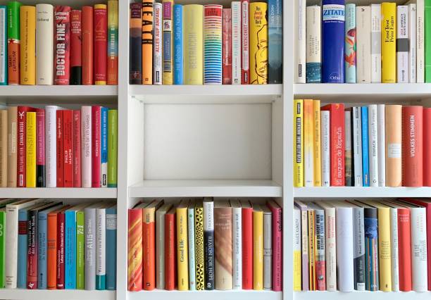 Library shelves and one part empty Library shelves and one part empty paperback photos stock pictures, royalty-free photos & images
