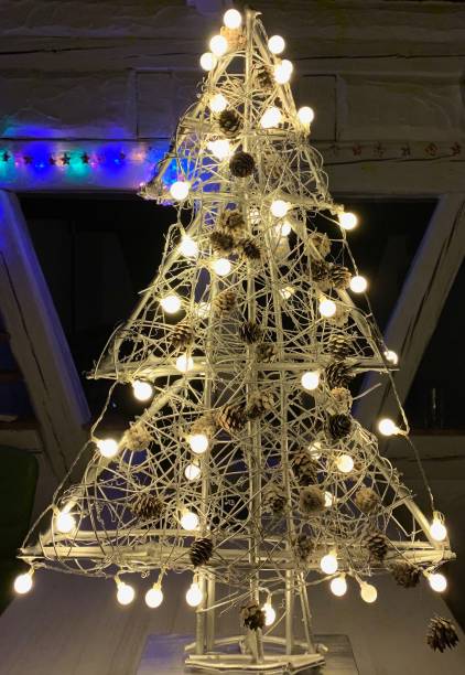 istock Abstract illuminated christmas tree in the dark 1057183642