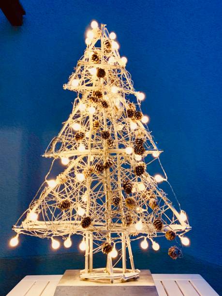 istock Abstract illuminated christmas tree in the dark 1057183710