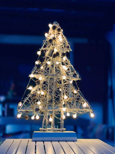 istock Abstract illuminated christmas tree in the dark 1057183776