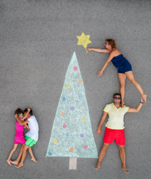 istock children argueing besides christmas tree, parents decorating 1057183998