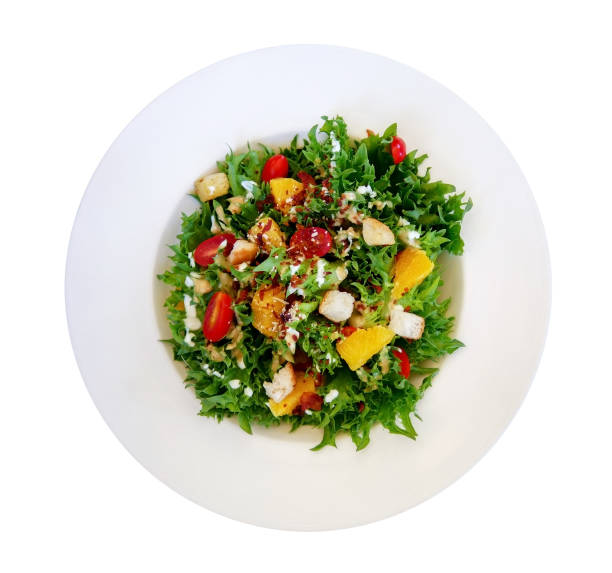 istock Fresh healthy green caesar salad top view solated on white background, clipping path included 1057184102