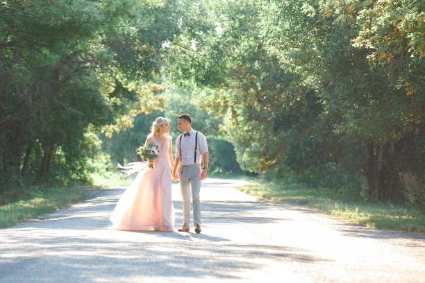 istock wedding couple on the nature in summer day. 1057186468