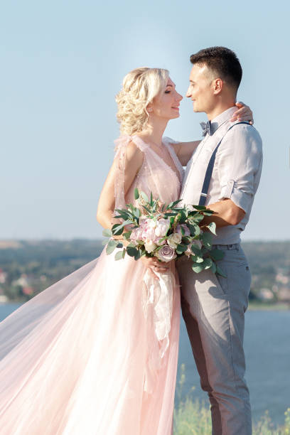 istock wedding couple on the nature in summer day. 1057186492